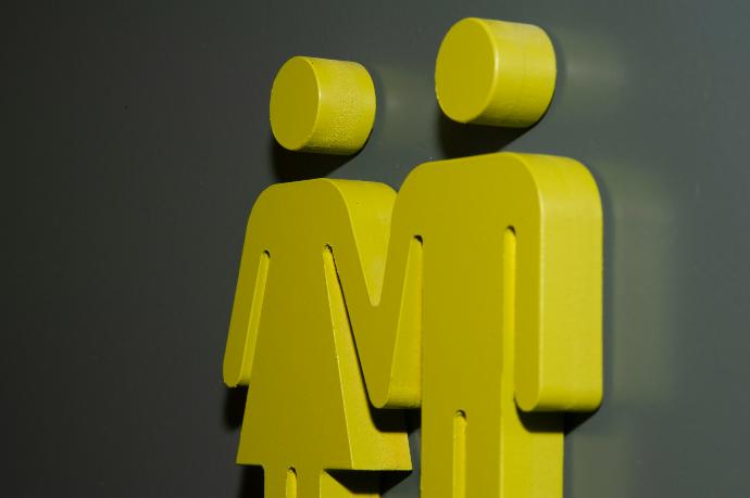 a couple of yellow people standing next to each other